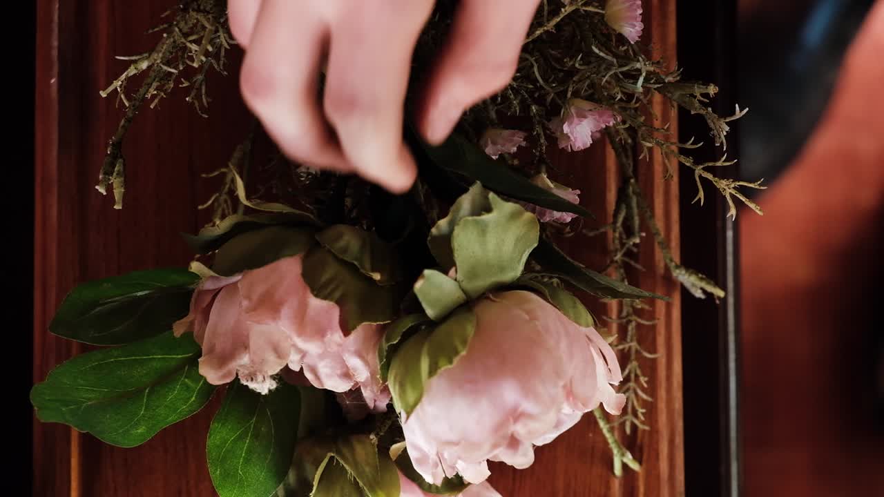 Flower placed on top of wooden burial ceremony coffin