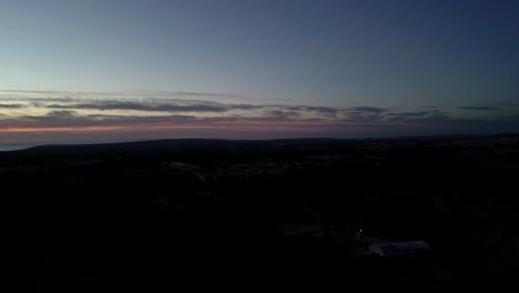 horizon skyline after sunset, clouds golden hour sky, aerial skyline view