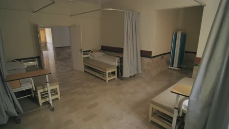 view of a vacant ward with empty beds in hospital.