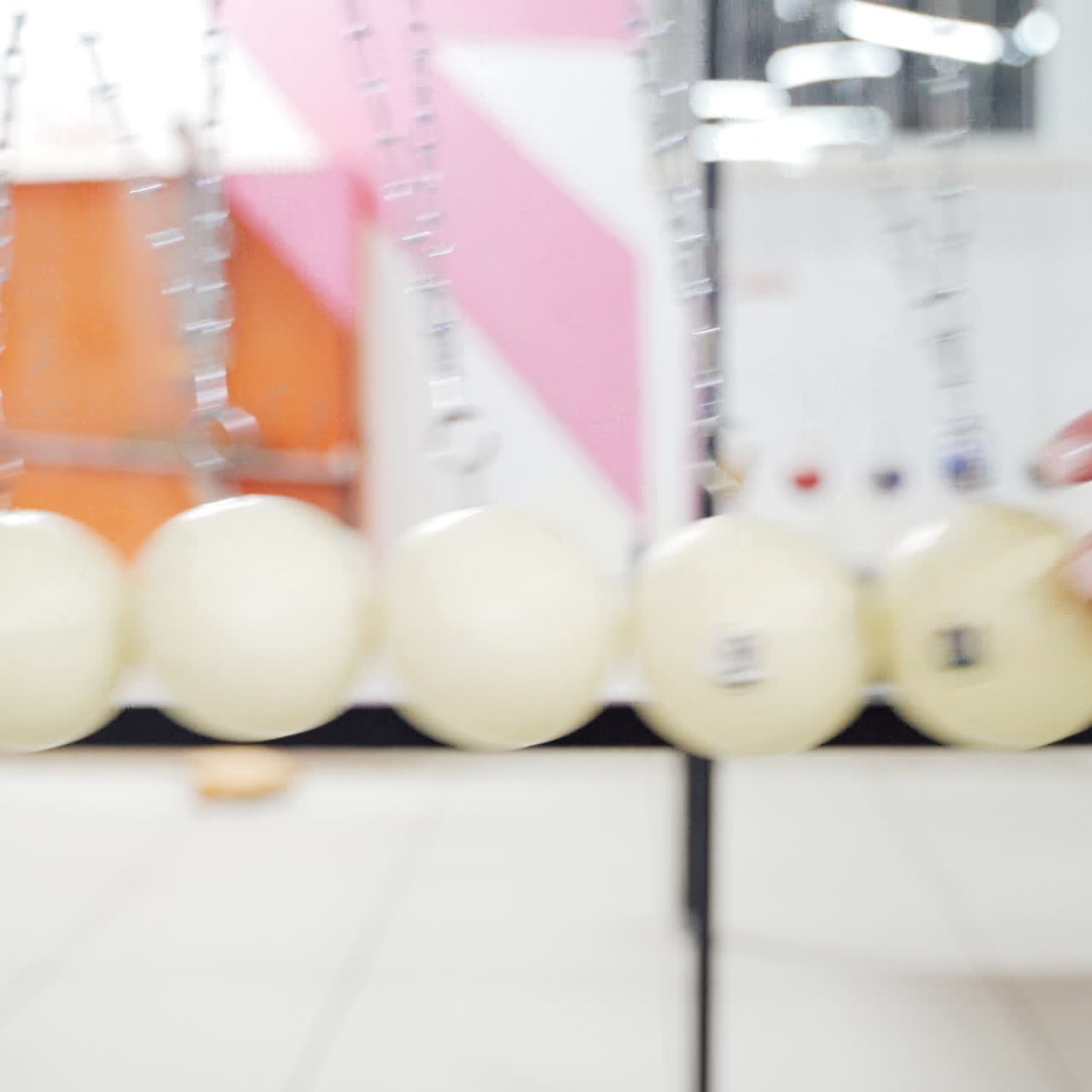 Newton's cradle showing laws of physics in motion. Museum of Science and newton pendulum