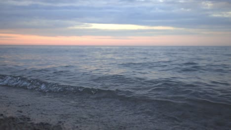 Ocean-Waves-Rolling-On-The-Beach-Shore-During-Sunset