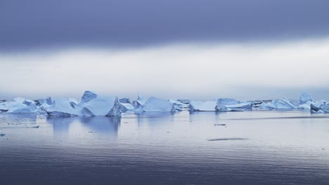 stunning icebergs in a calm ocean
