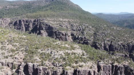 Arizona-drone-video-of-desert-and-green-mountains-with-cactus-and-a-water-creek