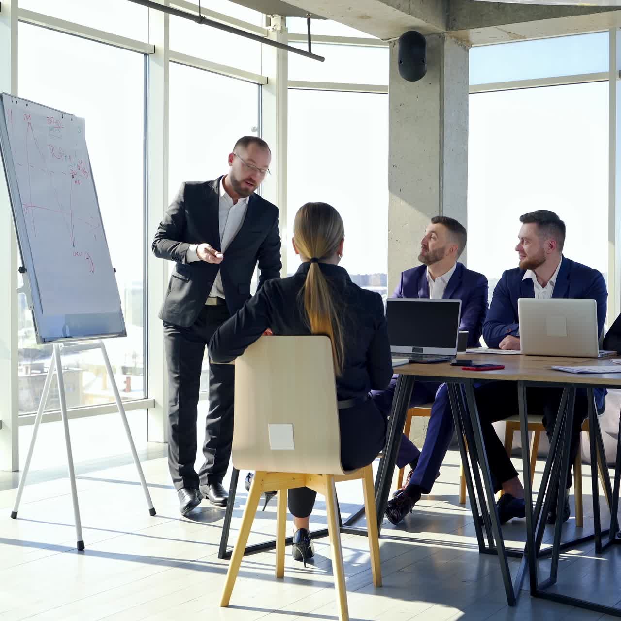 Young colleagues sitting at the business meeting in the office. Brainstorming at the office