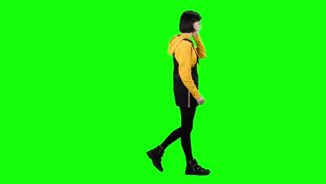 woman walking and talking on green screen