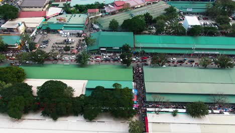 aerial-drone-viewing-the-crowded-traffic-side-street,-top-down-shot-from-Taytay-Tiangge,-Philippines