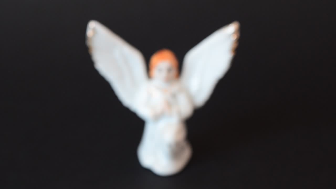 Figure of an angel. Shooting of a figurine