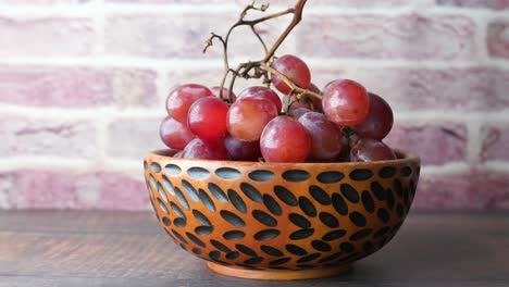 red grapes in a wooden bowl