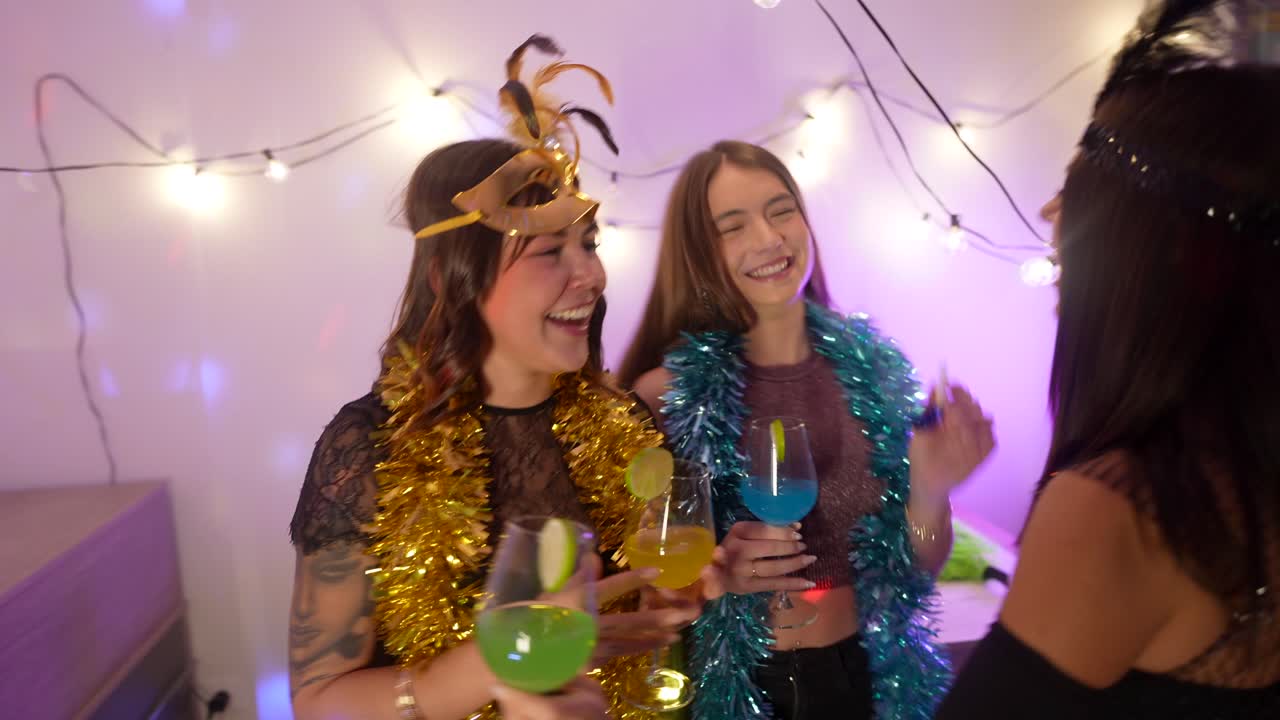 Women celebrating at a costume party with drinks