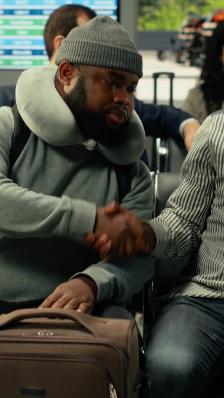 Multiethnic passengers waiting on their long-haul coach in busy bus station