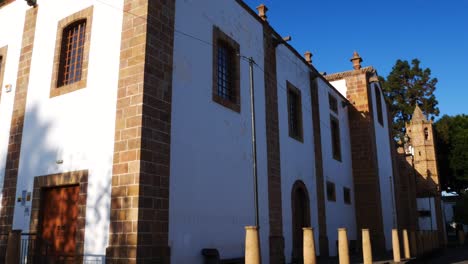 Tilt-down-view-from-an-old-church-to-a-small-street