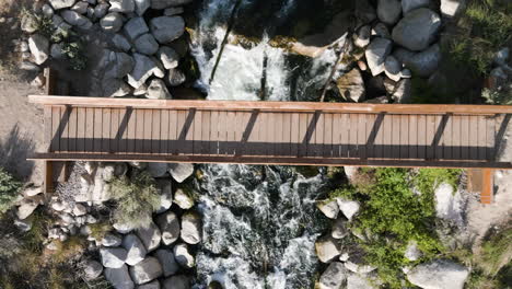 overhead view of a bridge over rapids on bell canyon trail in sandy, utah, usa