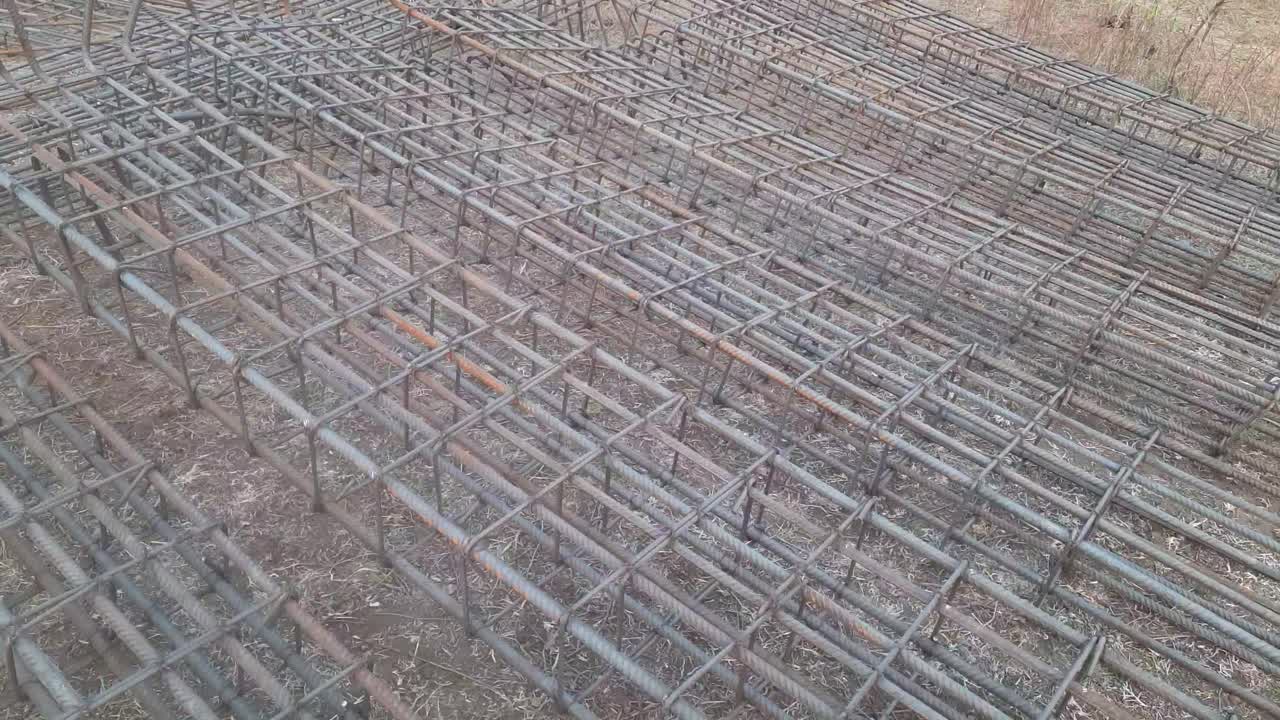 Reinforcement Steel column structure for building construction. The reinforcement frame of the column lies on the construction site - Reinforcement Column For Construction