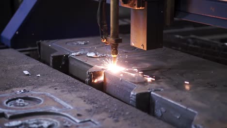 plasma cutting metal sheet in a factory