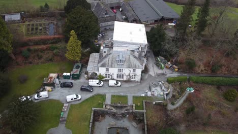 cinematic aerial drone footage of hawkshead village and st michael and all angels church