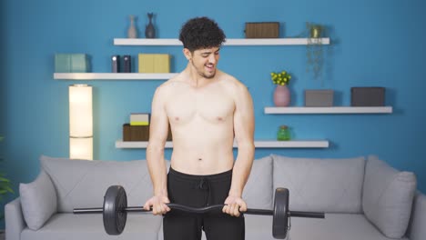 Entrenamiento-Con-Pesas-Hombre-Atleta-Mirando-A-La-Cámara.-Estilo-De-Vida-Saludable.