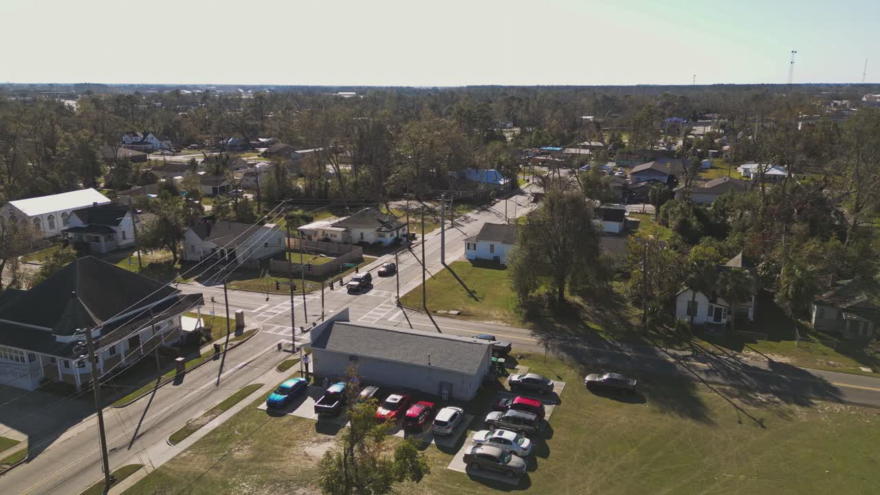 Aerial establishing sot of Suburb district of american town during sunset time. Houses and homes in suburb of Valdosta, Georgia. Wide shot.