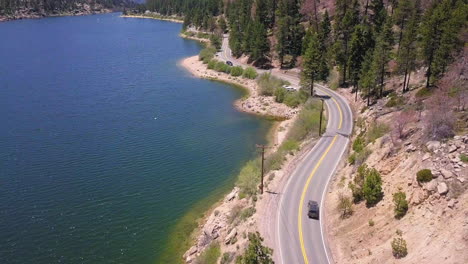 winding road along the lakeshore of big bear lake, california