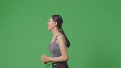 woman running on green screen