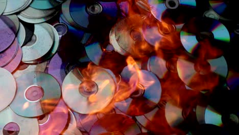 compact discs melt under the powerful hot flame of fire