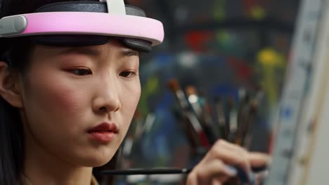 woman painting with vr headset
