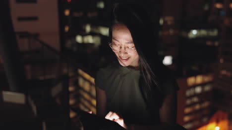 woman, digital tablet and rooftop at night in city