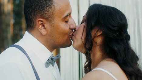 couple kissing on their wedding day