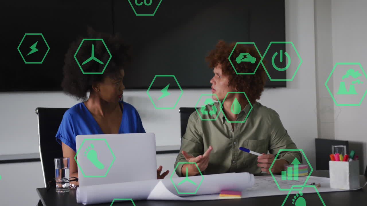 Discussing sustainable energy, two people with green animation icons overlaying