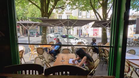 people enjoying a sunny day at a café