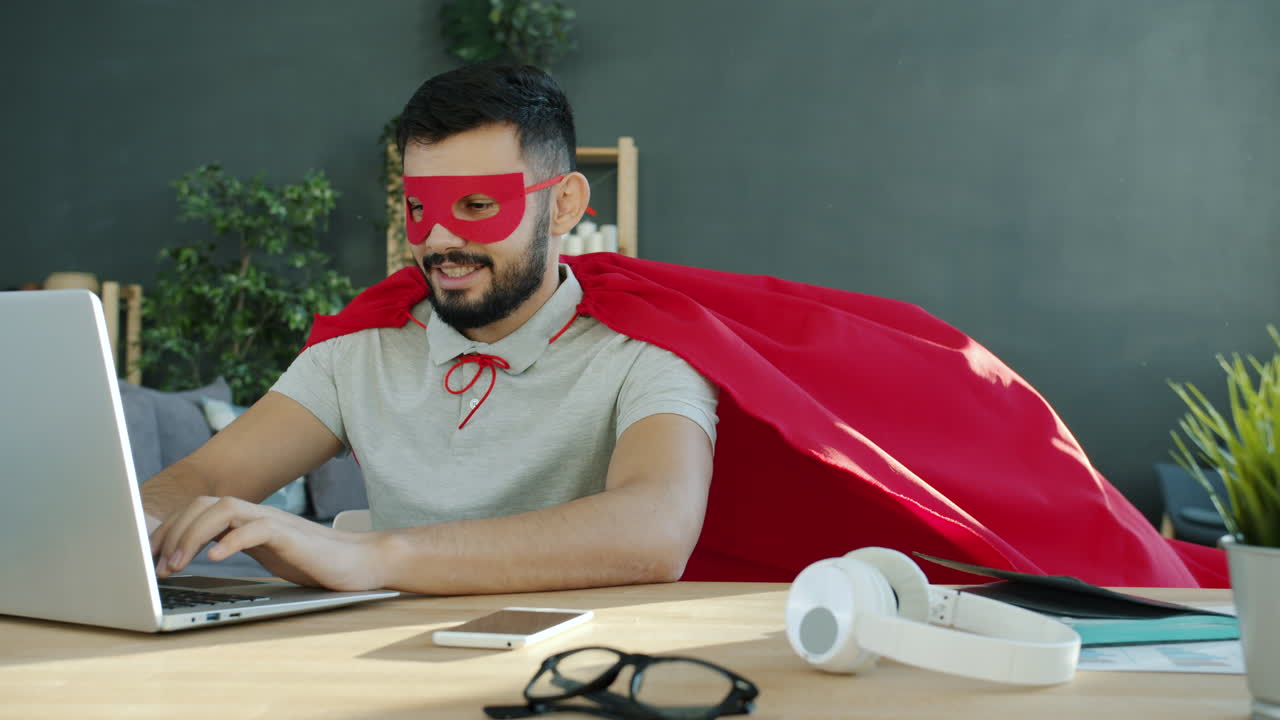 Superhero Working on Laptop in Office