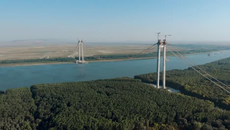 twin towers of the braila-tulcea bridge now connected with suspension cable over danube river in romania