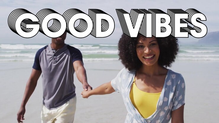 Woman leading couple walking toward camera on beach, GOOD VIBES overlay obscuring heads boosting ad