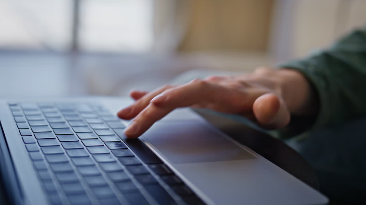 Man finger tapping spacebar using laptop in remote workplace cabinet closeup