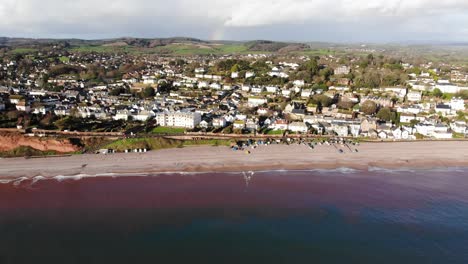 aerial rising backwards shot of budleigh salterton beach and town devon, england