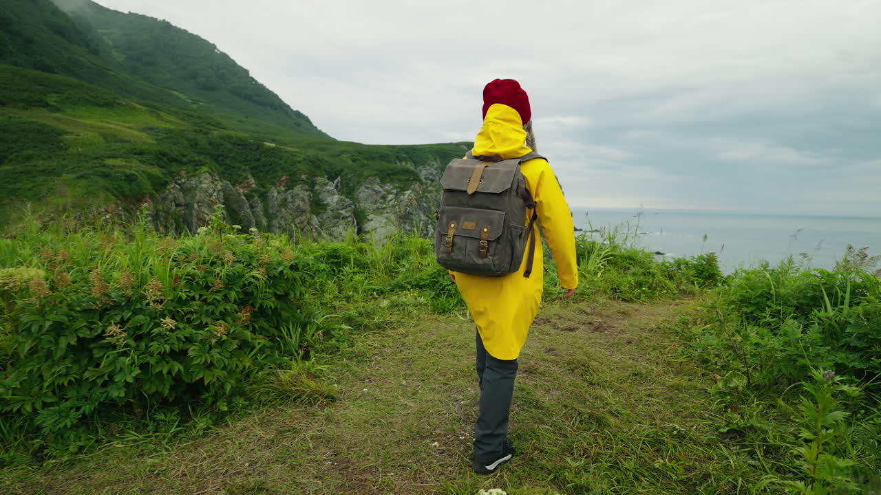 Woman Hiking on a Coastline
