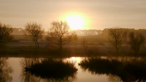 scenic sunrise over the nunnery lakes in thetford, norfolk, uk