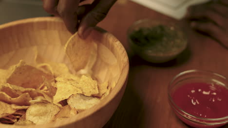 man eating tortilla chips