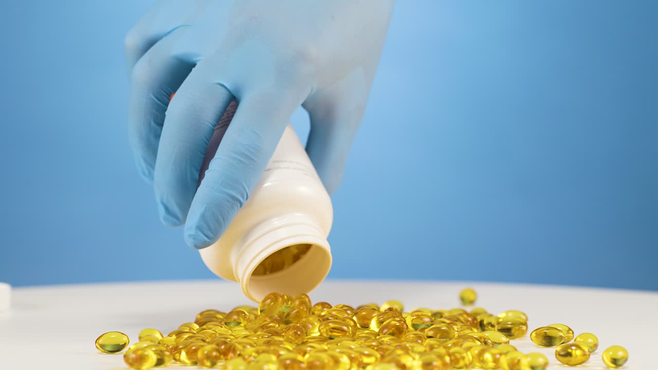 Slowmotion empty a white plastic container of Omega capsules on table