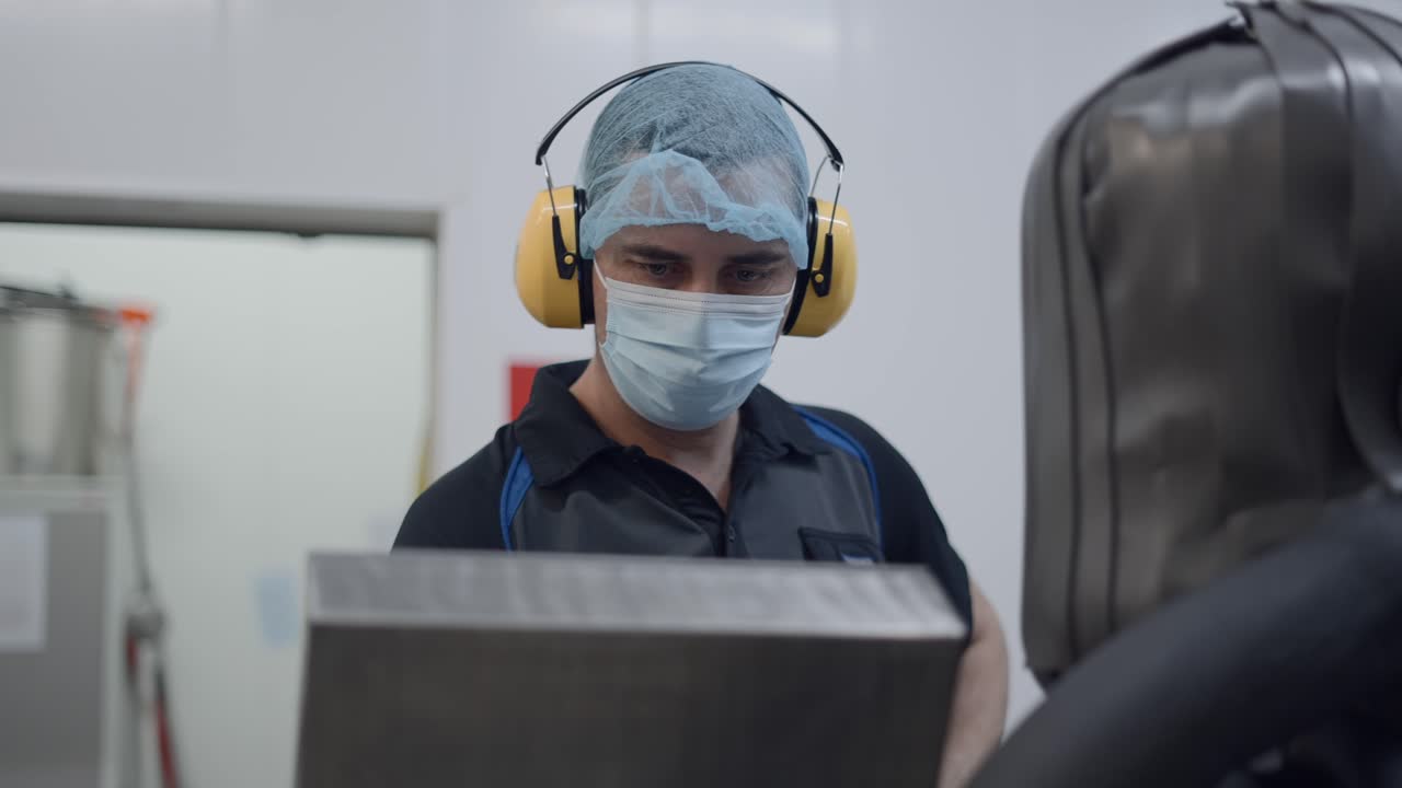 Worker in a food processing factory