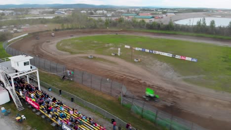 4k drone video of sprint car racing at mitchell raceway in fairbanks, ak during sunny summer evening-6