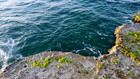 Turquoise-Blue-Sea-Splashing-On-Rocky-Coast-In-Enfeh,-Lebanon