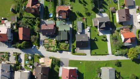 aerial drone, city and buildings with road of traffic in urban settlement above architecture or houses