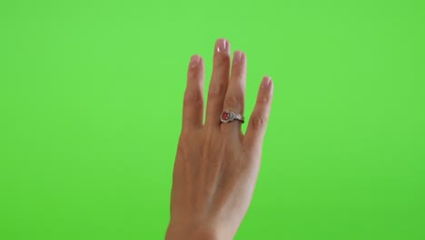 silver ring with red stone on tower in front of green screen display 4k 2160p ultrahd footage - greenscreen chroma key background silver ring presenting 4k 3840x2160 uhd video