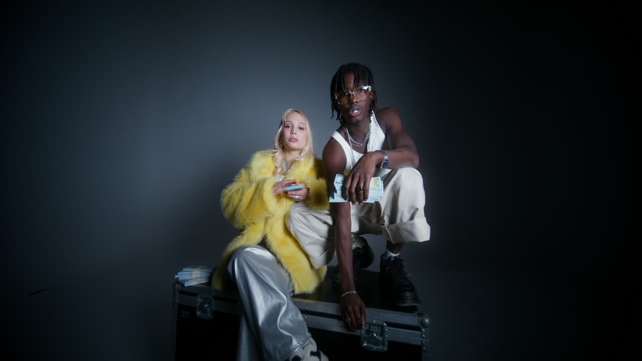 Young Couple Posing with Money