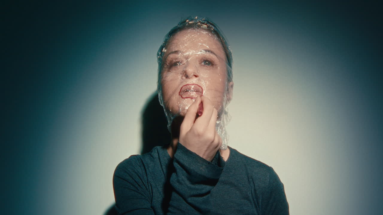 Woman with Plastic Wrap on Face