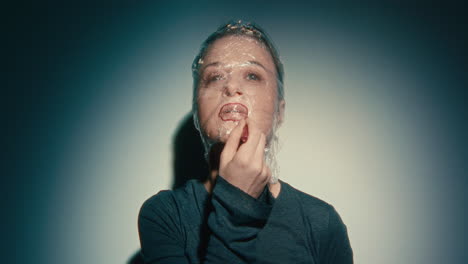 woman with plastic wrap on face