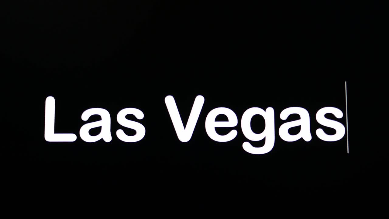 Tekst skrevet på sort skærm med ordet Las Vegas i hvidt