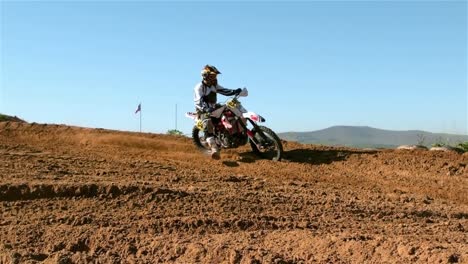 man riding a motor cross bike