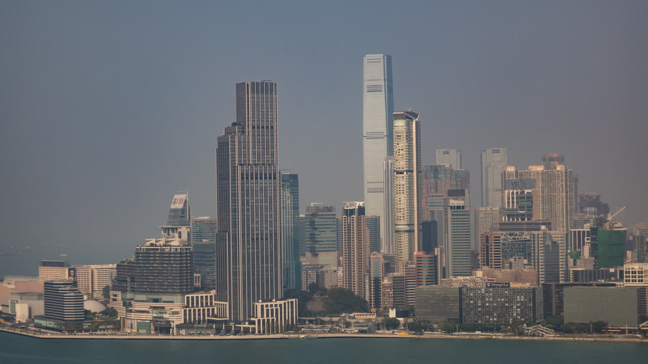 HONG KONG - 19 MARCH 2025 : Timelapse of the Hong Kong skyline and victoria harbour from a high vantage point