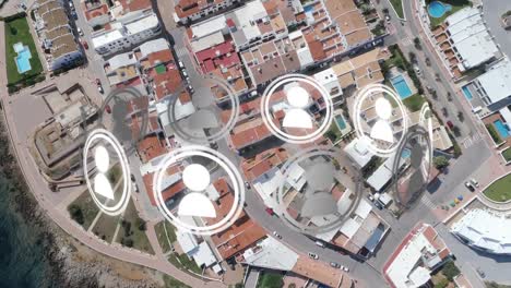 animation of ring of people icons rotating over aerial view modern buildings